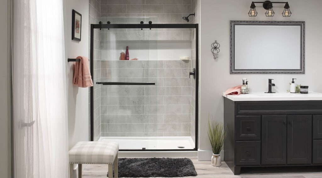 Modern bathroom after a shower remodel that installed a black framed glass shower enclosure